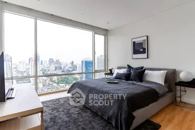 Luxurious bedroom with stunning city view and modern decor