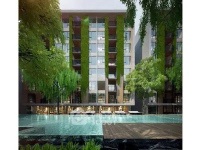 Luxurious modern apartment building with lush greenery and inviting pool area.