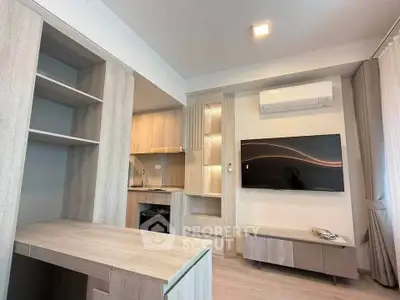 Modern living room with built-in shelves, air conditioning, and wall-mounted TV in a stylish apartment.