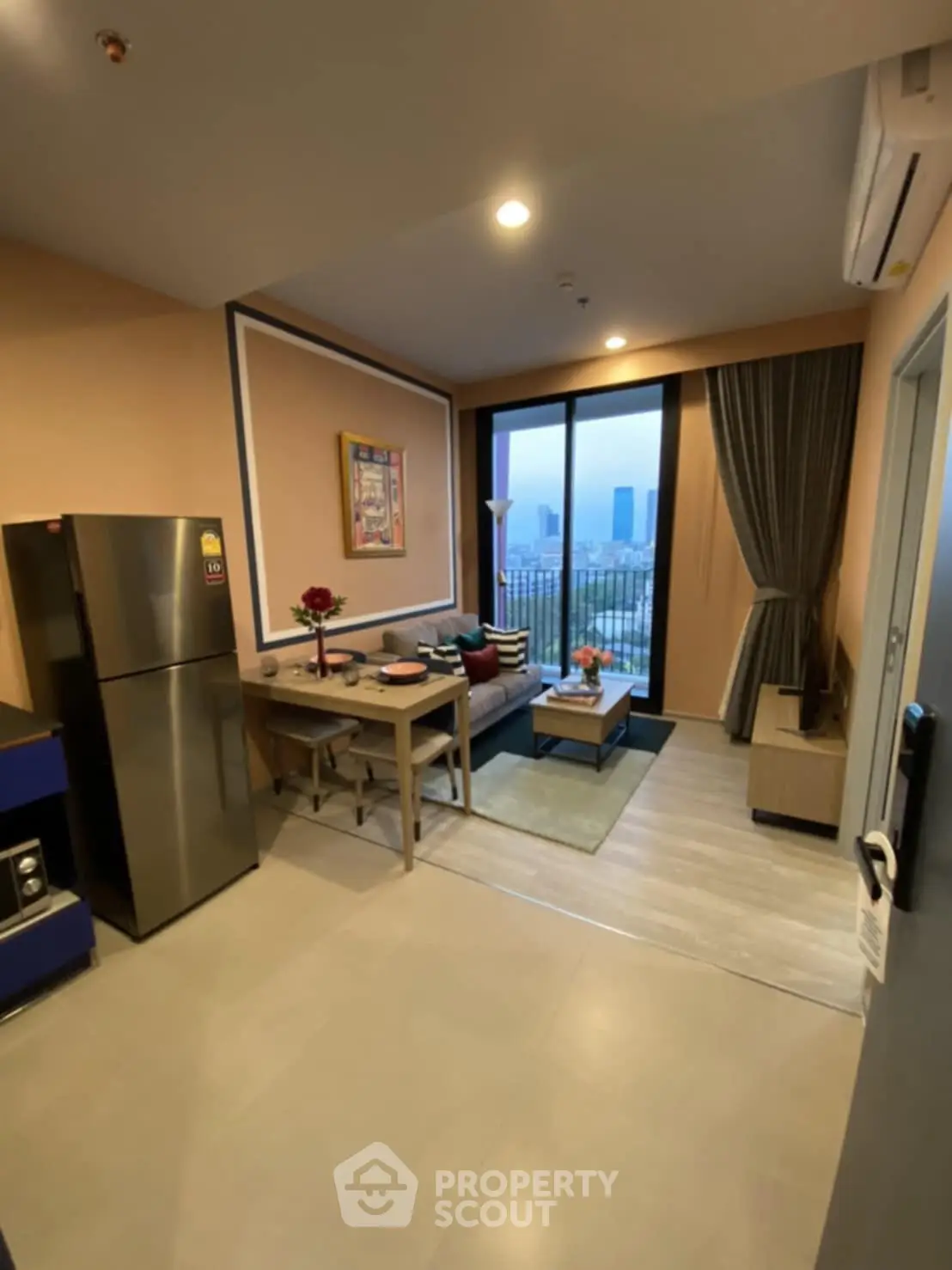 Modern living room with city view, stylish decor, and open layout for urban living.