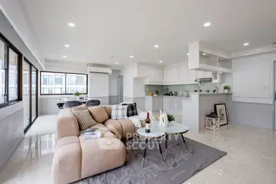 Spacious modern living room with open kitchen and elegant decor