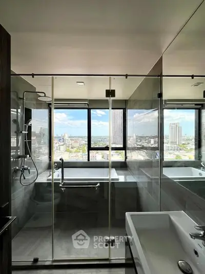 Luxurious bathroom with city view, featuring glass shower and modern fixtures.