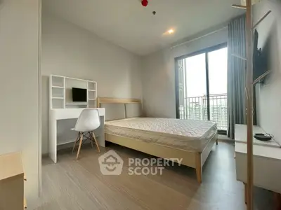 Modern bedroom with minimalist decor and balcony view