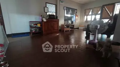 Spacious living room with wooden flooring and modern furniture