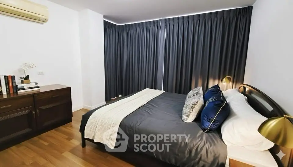 Cozy bedroom with elegant decor and ample natural light