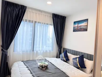 Cozy bedroom with elegant decor and large window view