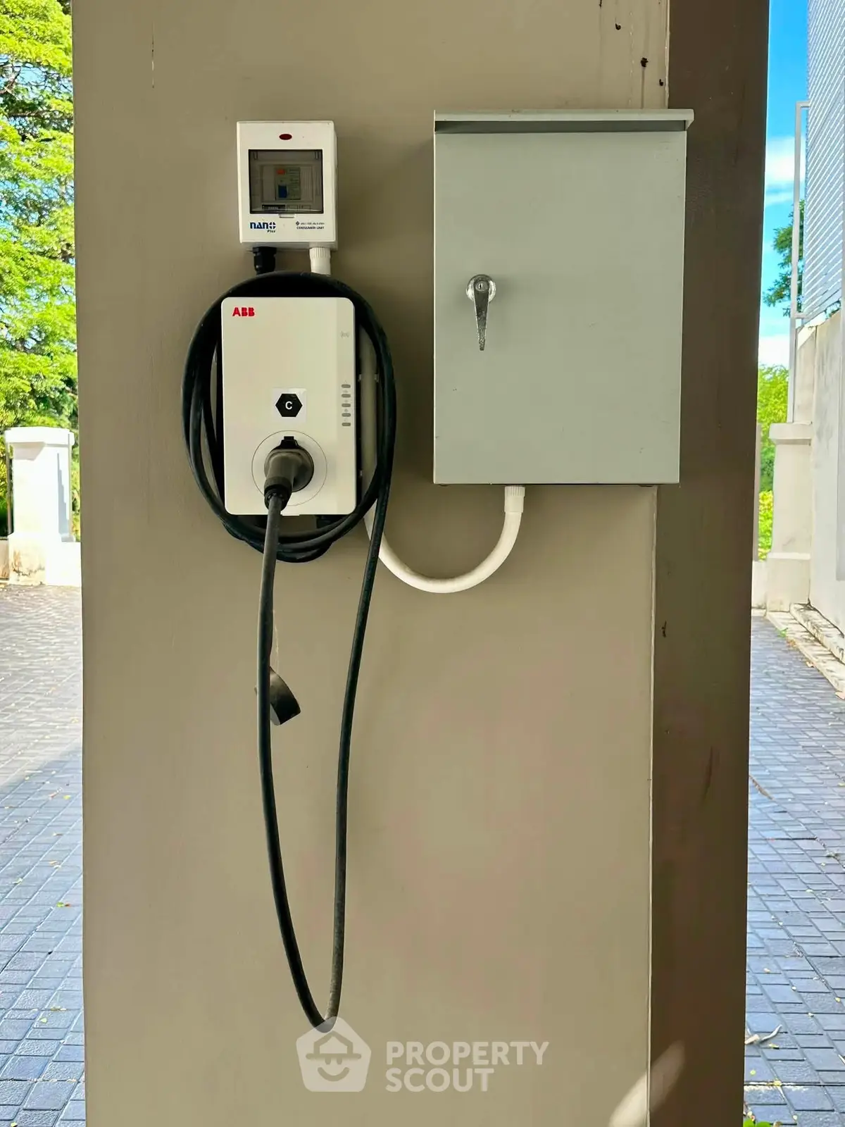 Modern electric vehicle charging station in residential parking area.