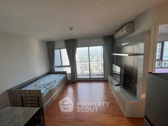 Spacious modern living room with large windows and city view