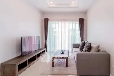 Modern living room with sleek furniture and natural light