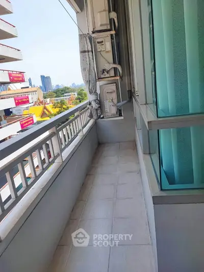 Spacious balcony with city view in modern apartment