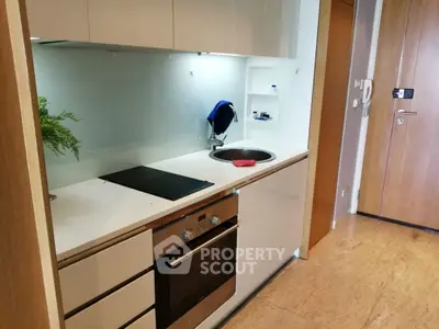 Modern kitchen with sleek design and built-in oven