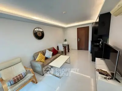 Modern living room with sleek furniture and stylish decor in a contemporary apartment.