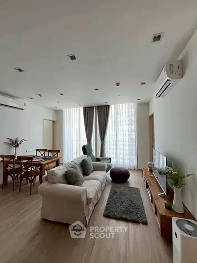 Spacious modern living room with elegant decor and natural light