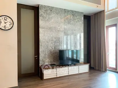 Modern living room with stylish TV unit and elegant decor