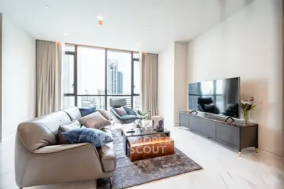 Luxurious modern living room with city view, featuring sleek furniture and large windows.