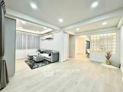 Spacious modern living room with elegant decor and ample natural light