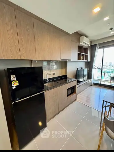 Modern kitchen with sleek appliances and open layout in a stylish apartment