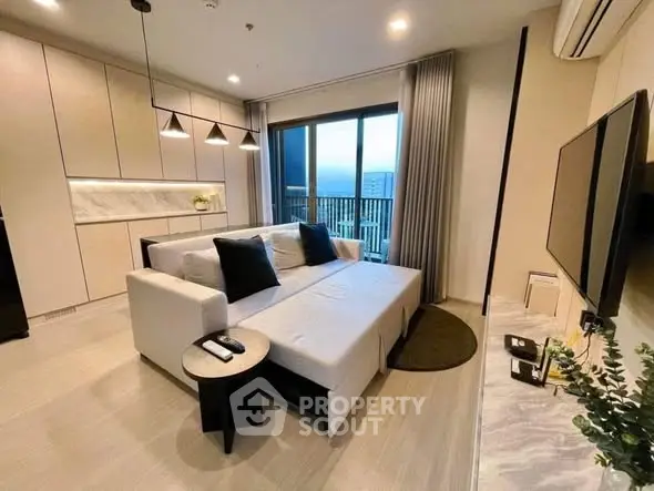 Modern living room with sleek design and balcony view