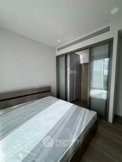 Modern bedroom with sleek design and ample natural light