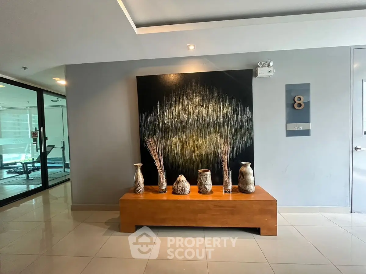 Stylish modern lobby with elegant decor and sleek design on the eighth floor.