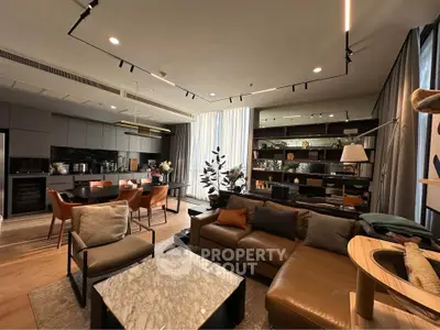 Luxurious modern living room with open kitchen and elegant decor