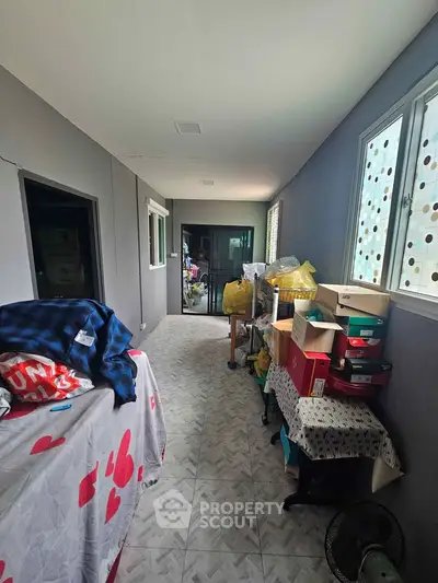 Spacious storage area with natural light and organized shelving, perfect for decluttering and maximizing space.