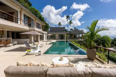 Luxurious villa with stunning pool and ocean view, perfect for tropical living.