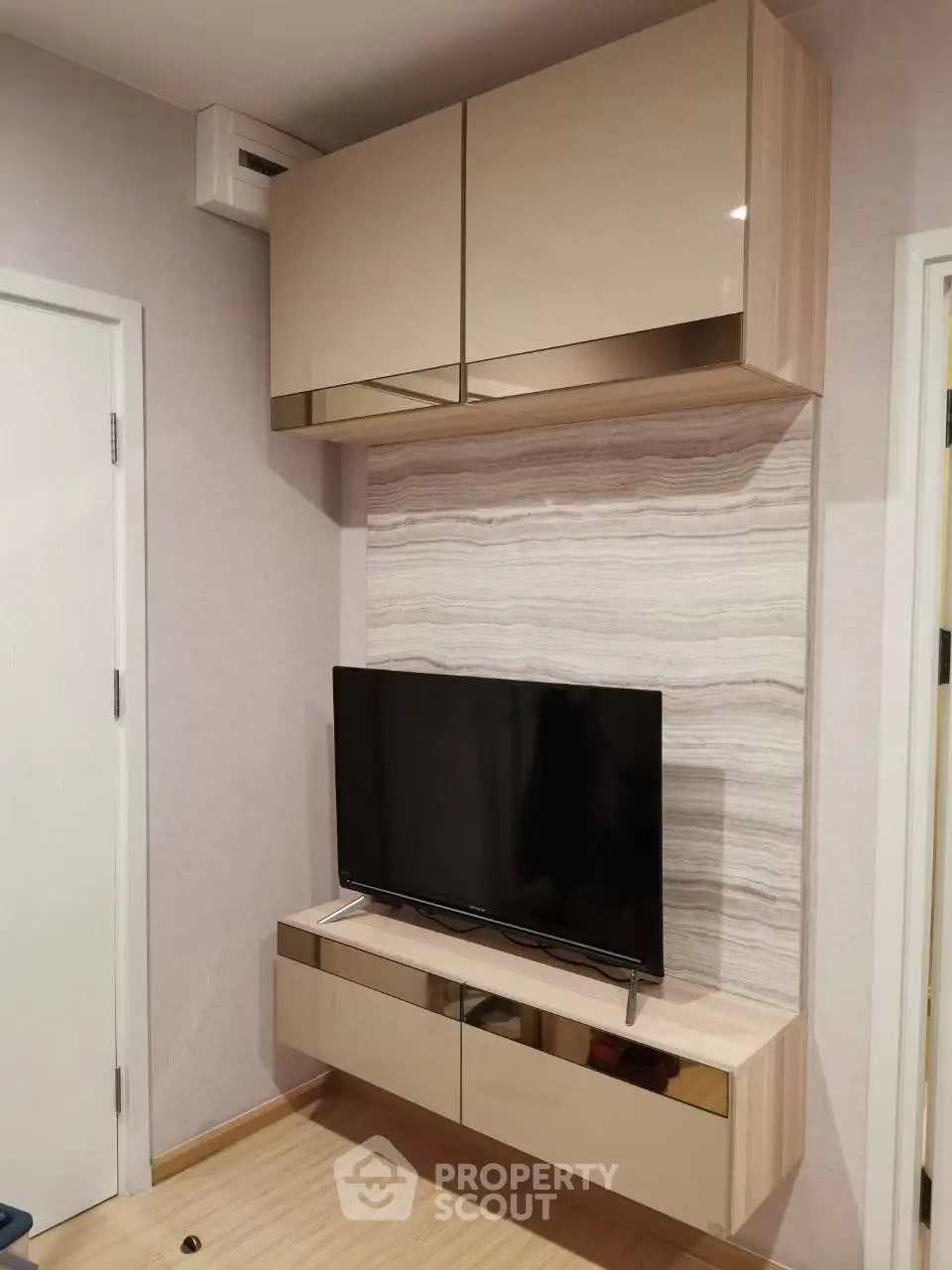 Modern living room with sleek TV unit and stylish cabinetry