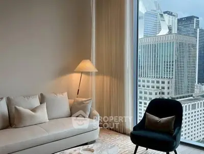 Luxurious living room with city view, elegant furniture, and floor-to-ceiling windows.