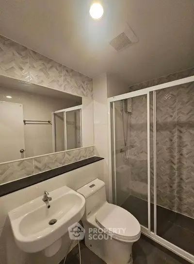 Modern bathroom with sleek shower and stylish tile design