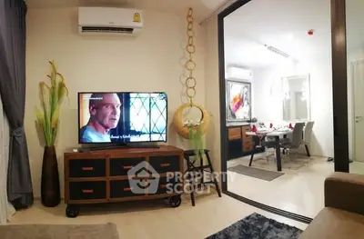 Modern living room with stylish decor and open layout to dining area.