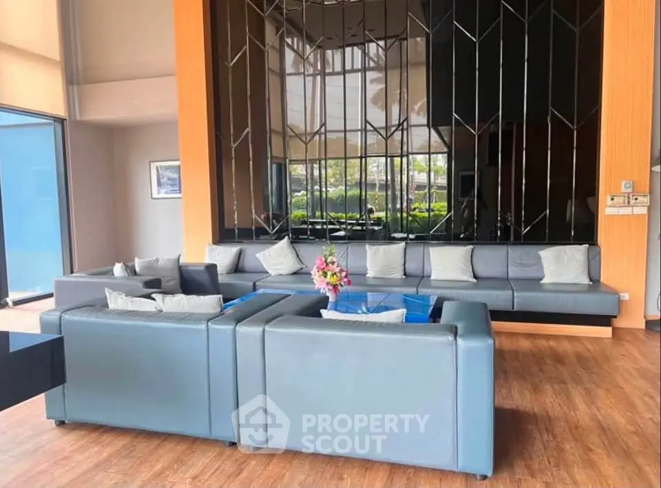 Luxurious modern living room with elegant decor and spacious seating area.