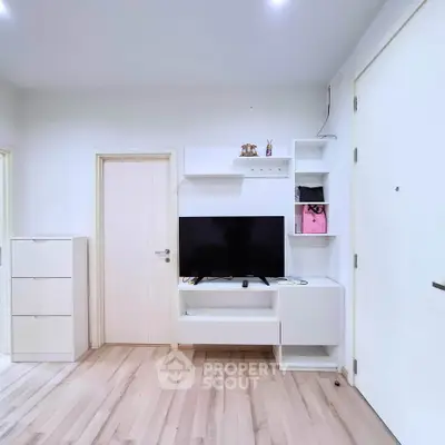 Modern living room with sleek TV unit and minimalist decor