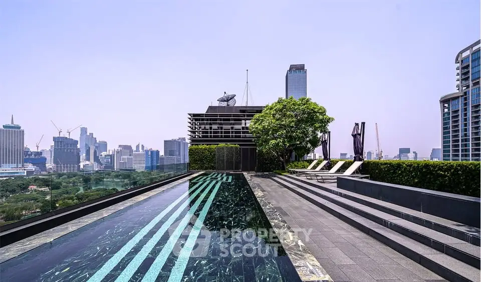 Luxurious rooftop pool with stunning city skyline view, perfect for relaxation and leisure.