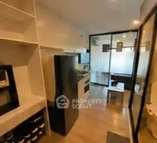 Modern kitchen with sleek appliances and open layout in stylish apartment
