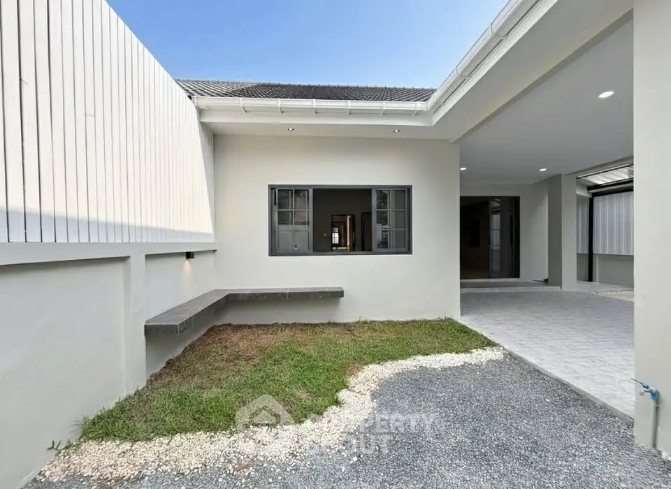 Modern home exterior with open courtyard and sleek design