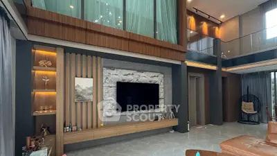 Luxurious modern living room with high ceilings and elegant decor