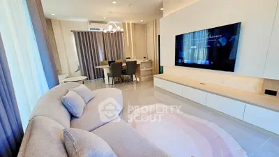 Luxurious modern living room with stylish furniture and large TV