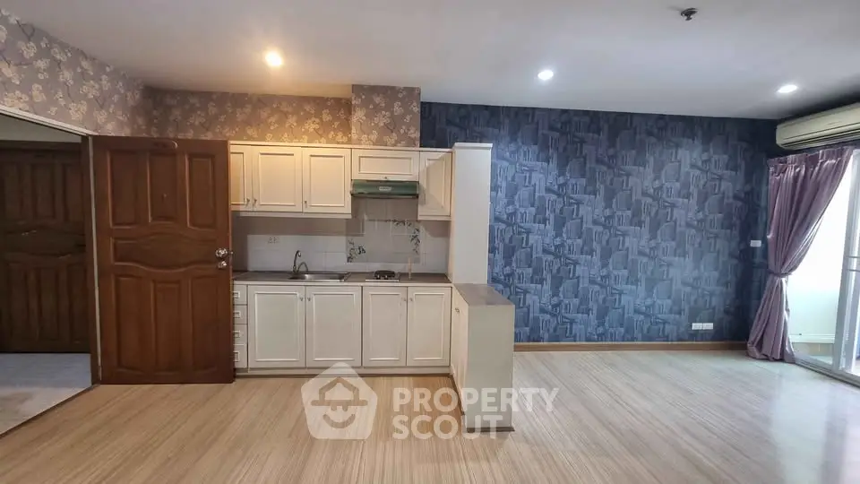 Spacious open-plan living area with modern kitchen and stylish decor