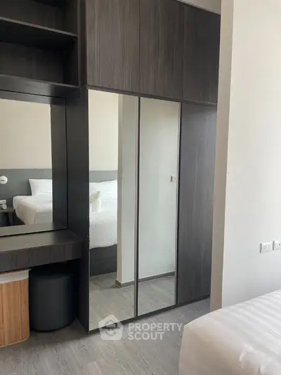 Modern bedroom with sleek wardrobe and stylish decor