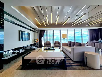 Luxurious living room with ocean view, modern furniture, and elegant lighting