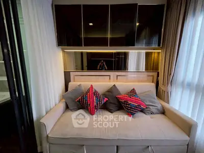 Cozy living room with modern sofa and vibrant cushions, perfect for relaxation and stylish living.