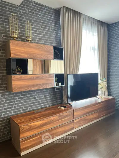 Modern living room with stylish wooden furniture and brick accent wall