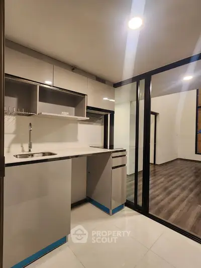 Modern kitchen with sleek cabinetry and open layout design