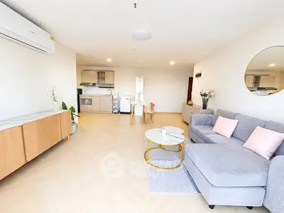 Spacious modern living room with open kitchen and stylish decor