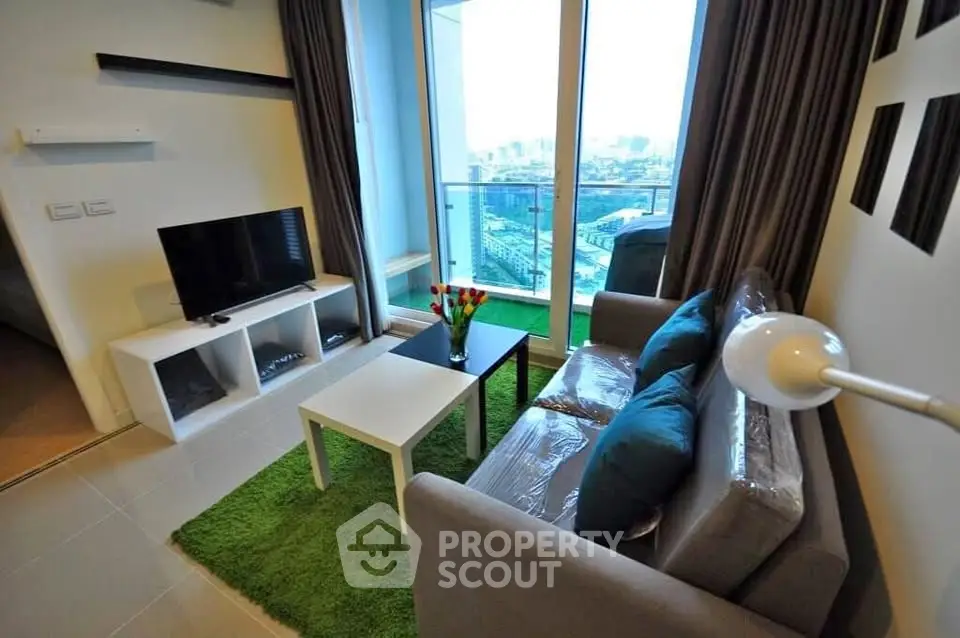 Modern living room with balcony view in high-rise apartment