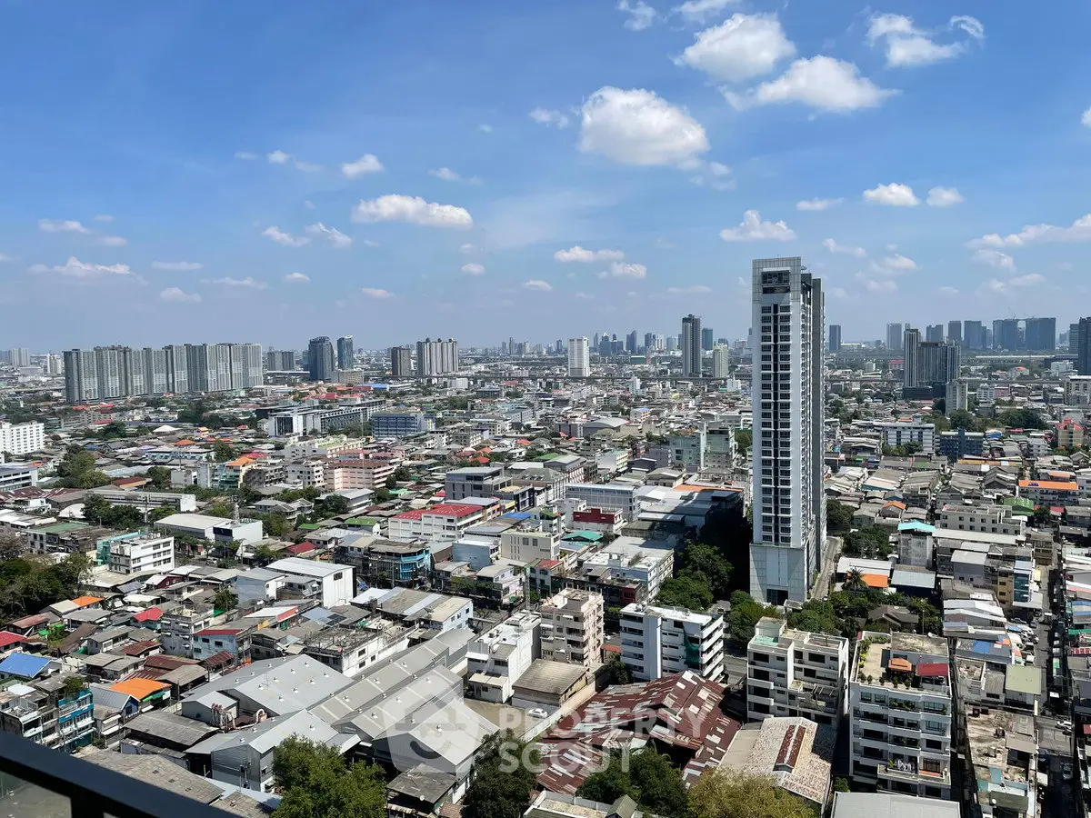 Stunning cityscape view from a high-rise building showcasing urban skyline and vibrant city life.