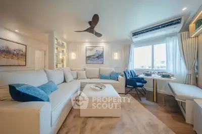 Luxurious living room with modern decor and large windows