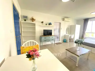 Bright and airy studio apartment with modern decor and natural light.
