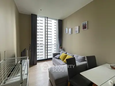 Modern living room with cozy sofa and dining area, featuring large windows and city view.